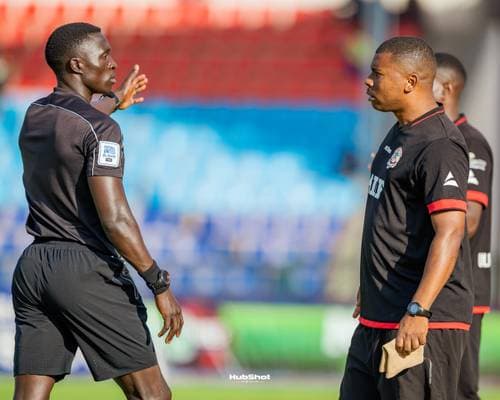 Coach shouting instructions from the touchline