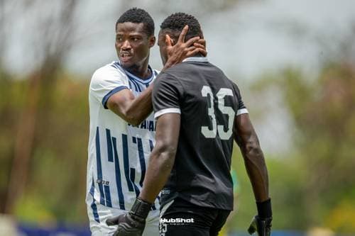 Goalkeeper consoling an opponent